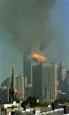 A ball of fire erupts from one of the towers of New York's World Trade Center as a hijacked airliner is deliberately crashed into it, September 11, 2001. The aircraft crashed into Tower 2 as Tower 1 (rear) burned after being hit minutes earlier by another hijacked airliner. Both towers collapsed to the ground a short time later. An aircraft was also crashed into the Pentagon near Washington this morning and another airliner crashed near Pittsburgh, Pennsylvania in apparently related actions.    REUTERS/Marco Castro