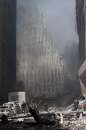 Firemen work near the base of the destroyed World Trade Center after planes crashed into each of the buildings in New York on September 11, 2001. Three hijacked planes crashed into major U.S. landmarks on Tuesday, destroying both of New York's mighty twin towers and plunging the Pentagon in Washington into flames, in an unprecedented assault on key symbols of U.S. military and financial power.    REUTERS/Peter Morgan