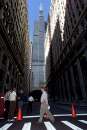 The Federal Reserve Bank of Chicago (building at left) and the road in front of it are closed as workers file out of the loop as many businesses close their doors as a precautionary measure following the terrorist attack in New York, September 11, 2001. Chicago's landmark Sears Tower is at rear.    REUTERS/Sue Ogrocki