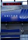 The sign above the empty United Airlines ticket counter reads, in it's entirety 'All Flights Cancelled Due To Our National Disaster' at Logan Airport in Boston, Massachusetts, September 11, 2001.  A United flight from Boston was one of those reportedly hijacked and crashed into the World Trade Center in New York.     REUTERS/Brian Snyder