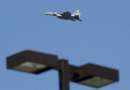 A United States military F-15 jet patrols the skies over Logan Airport in Boston, Massachusetts September 11, 2001 after two planes from Logan were reportedly hijacked and crashed into the World Trade Center in New York.     REUTERS/Brian Snyder