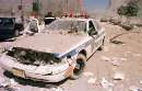 A New York Port Authority police vehicle is destroyed after the World Trade Center's collapse on Greenwich and Vessey Streets in lower Manhattan September 11, 2001. The World Trade Center buildings collapsed after two commercial airliners hit the buildings.    REUTERS/Anthony Correia