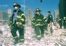 New York City firefighters wear face masks as they prepare to join other firefighters in battling blazes and helping injured people after the World trade Center buildings collapse September 11, 2001. Three hijacked planes slammed into the Pentagon and New York's landmark World Trade Center on Tuesday, demolishing the two 110-story towers that symbolize U.S. financial might.     REUTERS/Anthony Correia