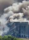 Fire fighters battle flames after a hijacked airplane crashed into the Pentagon, the U.S. military Headquarters, just outside of Washington, September 11, 2001. Three hijacked planes slammed into the Pentagon and New York's landmark World Trade Center on Tuesday, demolishing the two 110-story towers that symbolize U.S. financial might.  REUTERS/Larry Downing