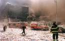 New York City firefighters and other emergency personnel survey the World Trade Center collapse area near Vessey and Greenwich Streets after the World Trade Center collapse September 11, 2001. In the worst attack on American soil since Pearl Harbor, three hijacked planes slammed into the Pentagon and New York's landmark World Trade Center on Tuesday, demolishing the two 110-story towers that symbolize U.S. financial might.   REUTERS/Anthony Correia