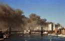 Smoke pours over the skyline of lower Manhattan shortly after the towers of the World Trade Center collapsed in New York on September 11, 2001. Three planes commandeered by unknown hijackers slammed into the Pentagon and New York's landmark World Trade Center on Tuesday, demolishing the twin 110-story towers that were once the tallest buildings in the world and possibly burying thousands of people alive.     REUTERS/Brad Rickerby