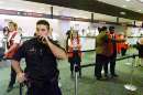 A San Francisco police officer talks on his radio in front of the United Airlines check-in counter at the San Francisco International Airport on September 11, 2001, shortly after news was received of the crash of United Flight #93, traveling from Newark, New Jersey to San Francisco. Flight #93 was one of the four planes hijacked in the worst act of terrorism in U.S. history. The plane crashed near Pittsburgh, Pennsylvania killiing all 45 people aboard.       REUTERS/Lou Dematteis