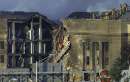 Fireman works on the roof of the Pentagon after a hijacked aircraft crashed into it, September 11, 2001. In the worst attack on American soil since Pearl Harbor, three hijacked planes slammed into the Pentagon and New York's landmark World Trade Center on Tuesday, demolishing the two 110-story towers that symbolize U.S. financial might. REUTERS/Kevin Lamarque