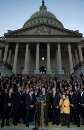 Members of the U.S. Congress bow their heads in silence in memory of the victims of the terrorist attacks during a ceremony at the U.S. Capitol September 11, 2001. The members of Congress met together to show their unity in a time of crisis and to reassure the nation that the government will continue to run normally.In the worst attack on American soil since Pearl Harbor, three hijacked planes slammed into the Pentagon and New York's landmark World Trade Center on Tuesday, demolishing the two 110-story towers that symbolize U.S. financial might.    REUTERS/Win McNamee