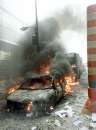 A car sits burning amid the rubble near the base of the destroyed World Trade Center in New York on September 11, 2001. In the worst terror attack on the U.S. mainland in modern history, two hijacked planes slammed into the twin towers of the World Trade Center in New York -- where about 40,000 people work -- and a third plane hit the Pentagon, across the Potomac river from Washington. The death toll, initially difficult to calculate, was expected to be in the thousands.     REUTERS/Peter Morgan