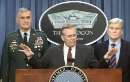 United States Secretary of Defense Donald Rumsfeld (C) briefs reporters September 11, 2001 on a day of terrorism in the United States. Chairman of the Joints Chief of Staff General Henry Shelton (L) and Senator John Warner (R-VA) look on.    REUTERS/William Philpott