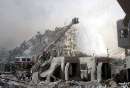 Firefighters work to put out fires amid rubble near the base of the destroyed World Trade Center in New York on September 11, 2001. In the worst terror attack on the U.S. mainland in modern history, two hijacked planes slammed into the twin towers of the World Trade Center in New York -- where about 40,000 people work -- and a third plane hit the Pentagon, across the Potomac river from Washington.  REUTERS/Peter Morgan