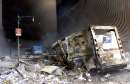 A U.S. postal service truck sits amid rubble near the base of the destroyed World Trade Center in New York on September 11, 2001. Planes slammed into each of the two towers, causing them to collapse.    REUTERS/Peter Morgan