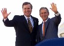 As President George W. Bush faced the enormity of aircraft attacks on New York and Washington, Florida Gov. Jeb Bush said September 11, 2001 he had not spoken with his brother since the incidents but wished him the best. President Bush waves with his brother from the steps of Air Force One as they prepare to leave Jacksonville, Florida, on Sept. 10.  (Win McNamee/Reuters)