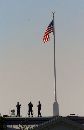 White House Secret Service officers looks at the smoke from the Pentagon as they stand on the roof of the White House September 11, 2001. In an unprecedented attack on the U.S. capital, an aircraft crashed next to the Pentagon setting off a huge explosion and a separate fire forced evacuation of the White House.  (Gary Cameron/Reuters)