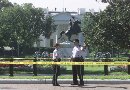 Uniformed Secret Service officers guard the perimeter of the White House at Lafayette Park September 11, 2001 after the building was evacuated due to terrorist activities in New York City, Washington and other U.S. cities. Panic-stricken Washington pedestrians froze in their tracks when they heard the whir of a plane overhead after plane attacks demolished New York's World Trade Center and damaged the Pentagon.  (Gary Cameron/Reuters)