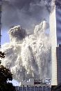 The World Trade Center tower two falls to the ground after both towers were struck by airplanes September 11, 2001. The two enormous edifices both fell in a huge cloud of smoke and fire two hours after the initial impacts. (Jeff Christensen/Reuters)