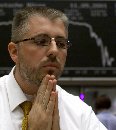 A German trader at the Frankfurt stock exchange reacts in front of the Dax board after two planes crashed into the twin towers of the World trade Center in New York, September 11, 2001. Financial markets descended into chaos after the hijacked planes slammed into the buildings, reducing its icons of U.S. financial might into smoking ruin and shaking investor confidence worldwide.  (Ralph Orlowski/Reuters)