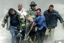 Rescue workers remove a man from one of the World Trade Center towers in New York City, early September 11, 2001. Both towers were hit by planes crashing into the buildings and collapsed a short time later. (Shannon Stapleton/Reuters)