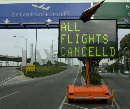 The White House said the Federal Aviation Administration has suspended all air traffic in the U.S. until at least noon Wednesday following the September 11, 2001 attacks on U.S. targets. A sign flashes that all flights are cancelled at the closed Los Angeles International Airport.  (Jim Ruymen/Reuters)