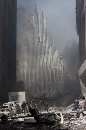 Firemen work near the base of the destroyed World Trade Center after planes crashed into each of the buildings in New York on September 11, 2001. Three hijacked planes crashed into major U.S. landmarks on Tuesday, destroying both of New York's mighty twin towers and plunging the Pentagon in Washington into flames, in an unprecedented assault on key symbols of U.S. military and financial power. (Peter Morgan/Reuters)