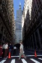 The Federal Reserve Bank of Chicago (building at left) and the road in front of it are closed as workers file out of the loop as many businesses close their doors as a precautionary measure following the terrorist attack in New York, September 11, 2001. Chicago's landmark Sears Tower is at rear. (Sue Ogrocki/Reuters)