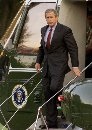 President George W. Bush returns to the White House aboard Marine One in Washington, September 11, 2001. Bush prepared to address the nation on the terrorist attack on the World Trade Center and the Pentagon. Bush's helicopter arrived at the White House at about 7 p.m. With a grim face, he strode purposefully toward the Oval office followed by top aides.  (Larry Downing/Reuters)