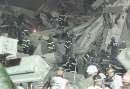 A group of firefighters search the remains of the destroyed World Trade Center in New York on September 11, 2001. Two hijacked U.S. commercial planes slammed into the twin towers of the World Trade Center on Tuesday, causing both 110-story landmarks to collapse in thunderous clouds of fire and smoke.      REUTERS/Shannon Stapleton