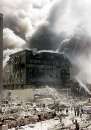 A group of firefighters work to put out fires in what is left of the destroyed World Trade Center in New York on September 11, 2001. Two hijacked U.S. commercial planes slammed into the twin towers of the World Trade Center early on Tuesday, causing both 110-story landmarks to collapse in thunderous clouds of fire and smoke. REUTERS/Shannon Stapleton