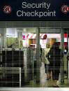 Airline and airport workers pass through the metal detector as they return to work and to be interviewed by law enforcement officials, in the American Airlines terminal at Logan Airport in Boston, Massachusetts, September 12, 2001. An American and a United flight from Boston were hijacked and crashed into the World Trade Center in New York City September 11. Airports across the country remain closed for flights for the time being.    REUTERS/Brian Snyder