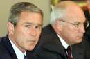 U.S. President George W. Bush, seated next to Vice President Dick Cheney, conducts a meeting with his national security team in the Cabinet Room of the White House, September 12, 2001. The meeting comes a day after terrorists struck New York City and Washington.    REUTERS/Kevin Lamarque