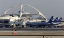 United Airlines jets sit at gates on the tarmac at Los Angeles International Airport, which has been closed for a second day September 12, 2001, due to terrorism acts in New York and Washington on September 11. The airport's theme building is in background. Several of the airplanes which crashed into the New York World Trade Center and the Pentagon in Washington were bound for Los Angeles. REUTERS/Fred Prouser