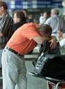 Bob Mavarich of Pittsburgh, whose flight was cancelled the day before, rests his head against his luggage as the 12:00 pm time that had been hoped for opening the airport passes, as stranded passengers wait outside the terminal at Hartsfield International Airport in Atlanta, Georgia, September 12, 2001. All airline flights in the United States remain grounded after attacks in New York City and Washington on September 11, 2001.  REUTERS/Tami Chappell