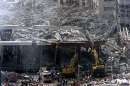 Workers dig in the wreckage of the World Trade Center in New York City, September 12, 2001. The World Trade Center towers were destroyed after being struck by airliners in a terrorist attack on Spetember 11.  REUTERS/Mike Segar