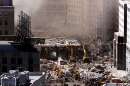 Workers dig in the wreckage of the World Trade Center as it lies across West Street in New York City, September 12, 2001. The World Trade Center towers were destroyed after being struck by airliners in a terrorist attack on September 11.  REUTERS/Mike Segar