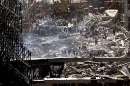 Hundreds of rescuers and emergency workers swarm all over the wreckage of the World Trade Center Towers, in New York September 12, 2001 as they search for trapped survivors of the terrorist attack on the New York landmark. Two hijacked commercial airliners were deliberately crashed into the twin towers, bringing them crashing to the ground September 11.   REUTERS/Jim Bourg