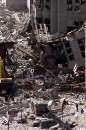 Workers dig in the wreckage of the World Trade Center as it lies across West Street in New York City  September 12, 2001. The World Trade Center towers were destroyed after being struck by two planes in a terrorist attack on September 11.  REUTERS/Mike Segar