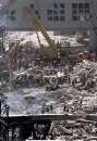 Workers dig in the wreckage of the World Trade Center as it lies accross West Street in New York City  September 12, 2001. The World Trade Center towers were destroyed after being struck by planes in a terrorist attack on September 11.  REUTERS/Mike Segar