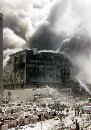 A group of firefighters work to put out fires in what is left of the destroyed World Trade Center in New York on September 11, 2001. Two hijacked airliners slammed into the twin towers of the World Trade Center early on Tuesday, causing both 110-story landmarks to collapse in thunderous clouds of fire and smoke. (Shannon Stapleton/Reuters)