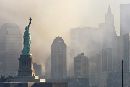 Smoke from the remains of New York's World Trade Center shrouds lower Manhattan as the Statue of Liberty stands in this image taken across New York Harbor from Jersey City, New Jersey, September 12, 2001. Each of the twin towers were hit by hijacked airliners and collapsed in acts of terrorism directed at the United States September 11, 2001. (Ray Stubblebine/Reuters)