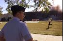 US Air Force Maj. Paul Smith watches plumes of smoke after a passenger plane crashed into the Pentagon in Washington Tuesday, Sept. 11, 2001. (AP Photo/Hillery Smith Garrison)